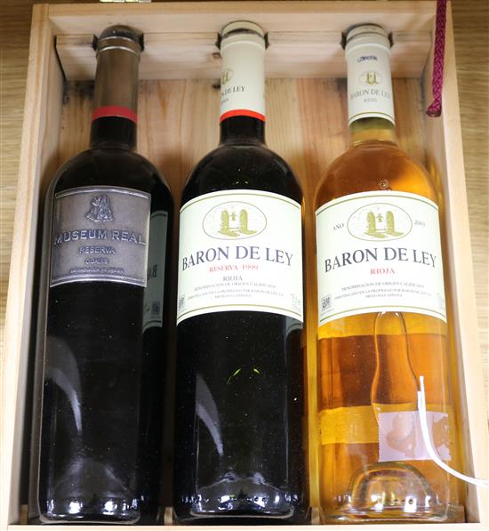 Three bottles of Baron de Ley Rioja in wooden presentation box,